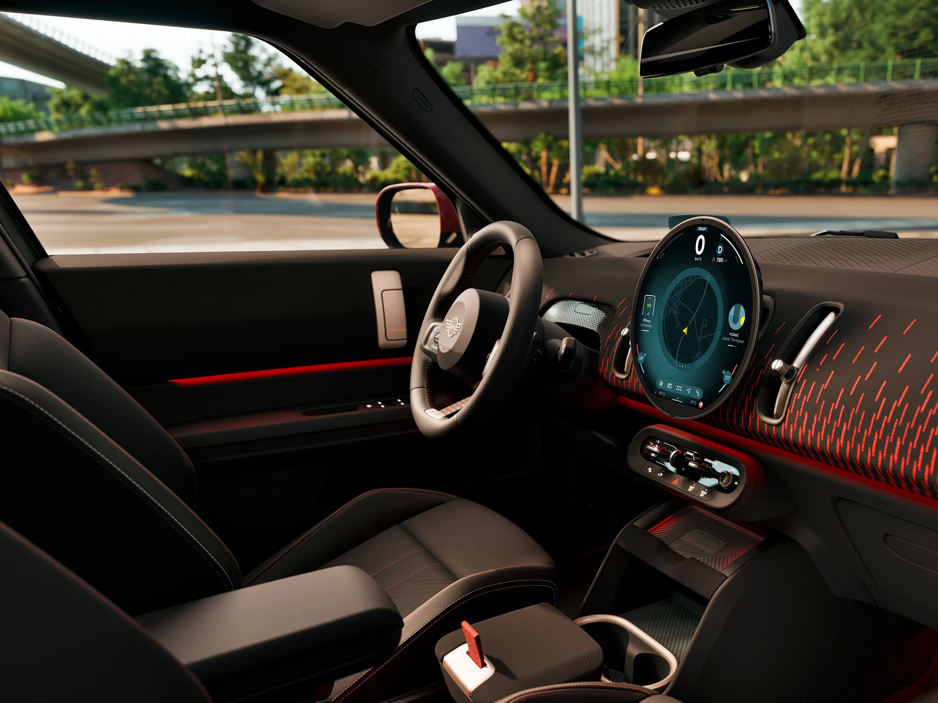 MINI Countryman interjero vaizdas iš šono su John Cooper Works apdaila puoštu prietaisų skydeliu.