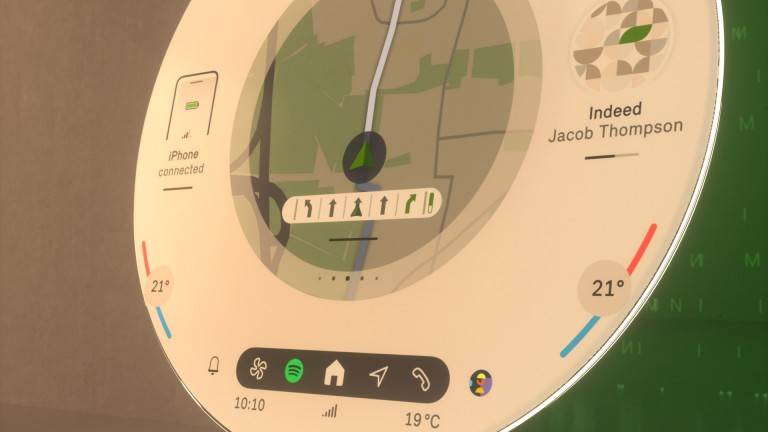 Apvalus MINI ekranas, rodantis navigacijos sistemos informaciją ir valdiklius